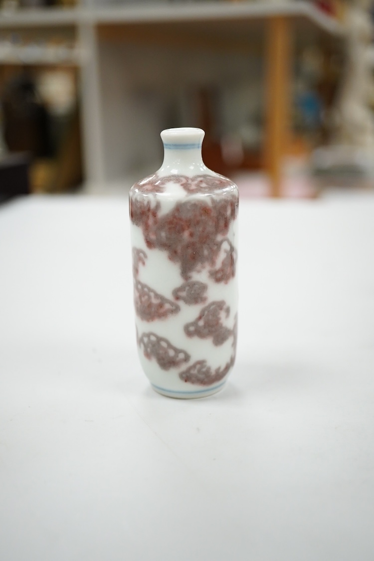 A Chinese cinnabar lacquer snuff bottle, a glass overlay snuff bottle and an underglaze copper red snuff bottle-9cm high (3)
